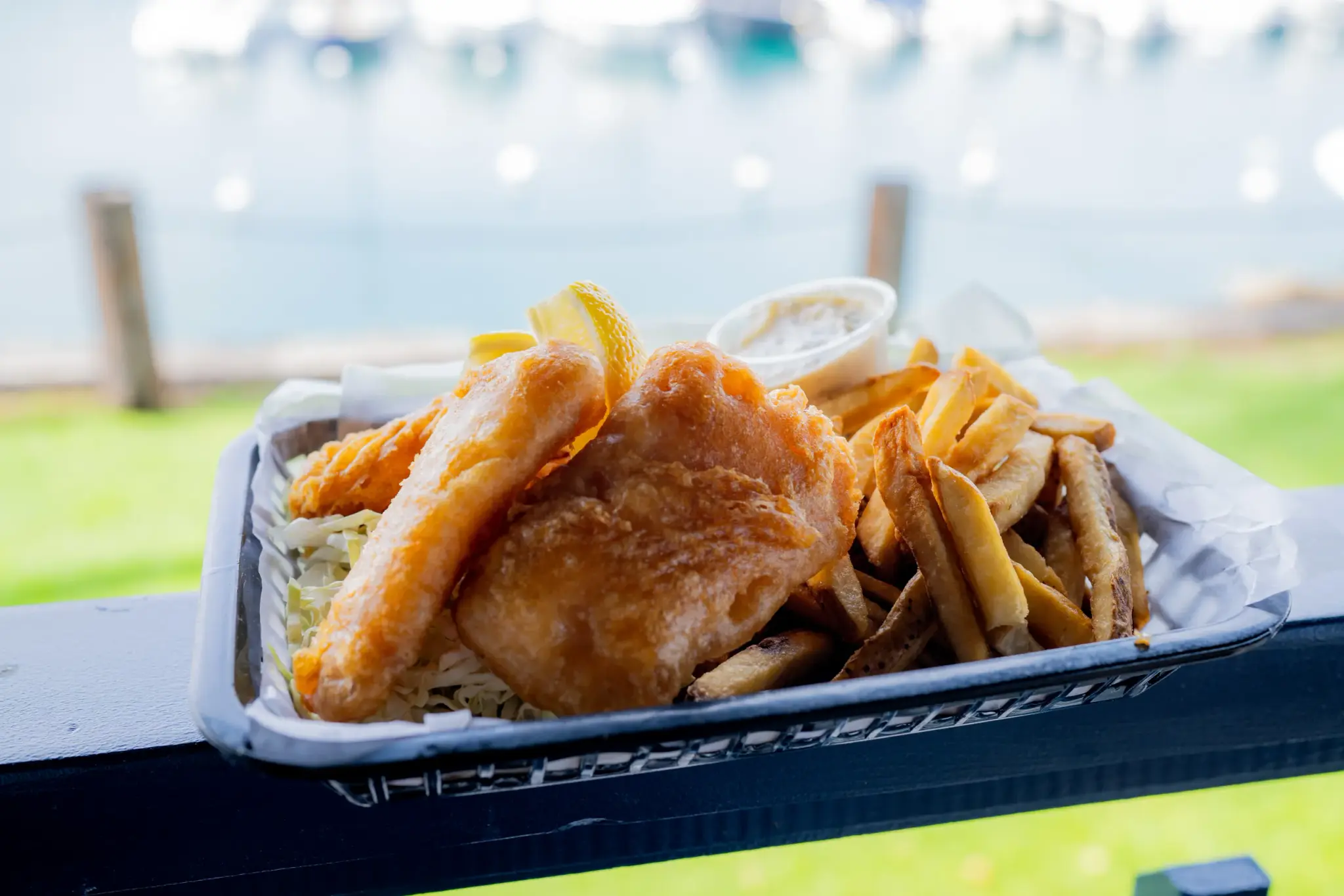 Fish & Chips at Harbor House Kona, Golden beer-battered fish with a basket of fries, harbor-side.